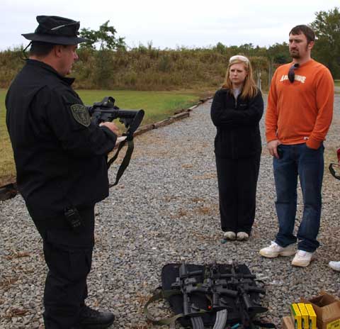 Lt. J.W. Plouch of the Bryant Police Department provides safety and usage instruction on the M4 rifle. (Photo by Lana Clifton)