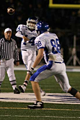 Jimi Easterling (14) flings a pass toward tight end. (Photo by Rick Nation)