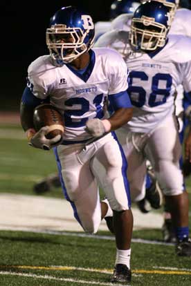 Bryant's Chris Rycraw cuts upfield off a block by teammate Jordan Murdock. (Photo by Rick Nation)