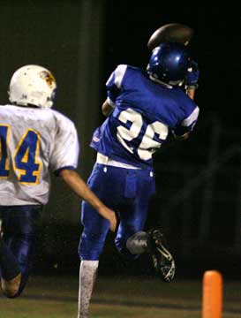 Devin Sears hauls in a touchdown pass behind Sheridan's Nathan Wadley (14). (Photo by Rick Nation)