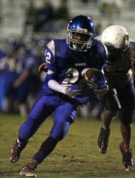 Marcus Wilson (22) caught a 50-yard touchdown pass and this 35 yarder to set up another score. (Photo by Rick Nation)