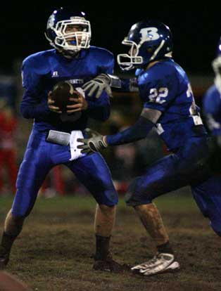 Blake Davidson hands off to Jacob Powell. (Photo by Rick Nation)