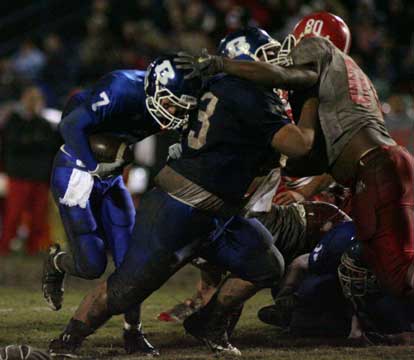 Bryant center Justin Rauch (73) moves out Cabot noseman T.J. Bertrand (80) to make room for Chris Arnold (7). (Photo by Rick Nation)