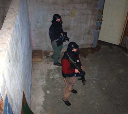 CPA students searched rooms in the “SWAT” house looking for armed villains. (Photo by Lana Clifton)