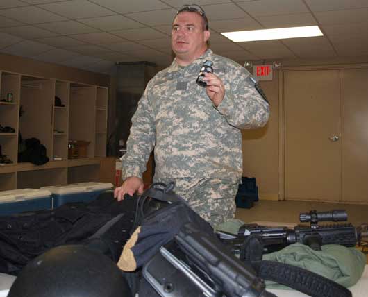 Lt. J.W. Plouch describes the gear issued to Emergency Response Team members. (Photo by Lana Clifton)