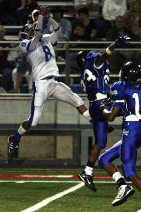 Bryant's Aronn Bell (8) goes high to make an interception. (Photo by Rick Nation)