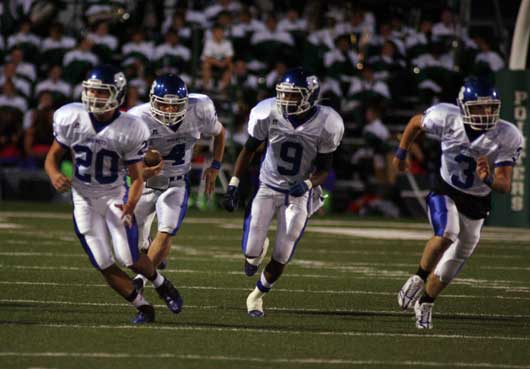 Logan Garland (4) gets an excort upfield on one of his two long kickoff returns by Tanner Tolbert (20), Sammille Watson (9) and Brady Butler (3). (Photo by Rick Nation)