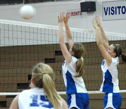 Peyton Thacker and Ashley Chaloner go up for a block in a recent Bryant JV match. (Photo by Mark Hart)