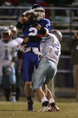 Brandon Parish caught seven passes Friday night, this one while being drilled by Southside defender Jerry Reynolds. (Photo by Rick Nation)