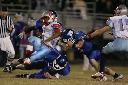 Brady Butler and Tanner Tolbert converge on Southside's Julius Jones. (Photo by Rick Nation)