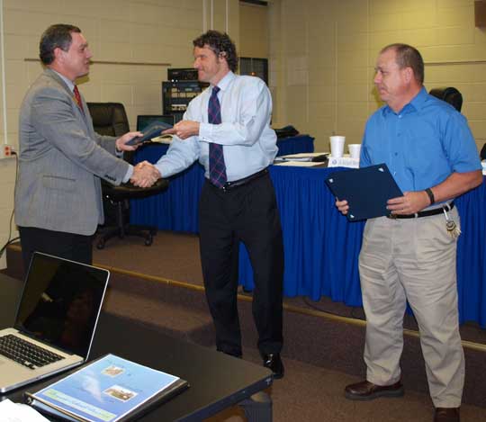 Dr. Richard Abernathy presents the Outstanding School Board Member Award to Board Member Scott Hart after making the same presentation to board member Joe Wishard, right. (Photo by Lana Clifton)