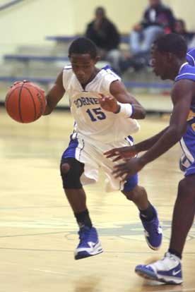 Bryant's Aaron Bell (15) drives around a North Little Rock defender. (Photo by Rick Nation)