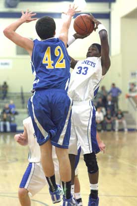 Bryant's Leon Neale (33) shoots over North Little Rock's Matt Terry. (Photo by Rick Nation)