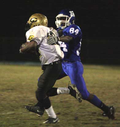 Bryant's Kendrick Farr (84) hauls down a Central running back. (Photo by Rick Nation)