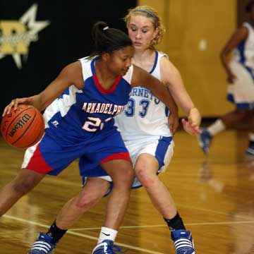 Bryant's Abbi Stearns (33) pressures Arkadelphia point guard Brittee Williams. (Photo by Rick Nation)