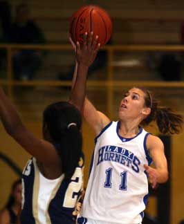 Haley Montgomery shoots over Pulaski Academy's Breanna Harris. (Photo by Rick Nation)