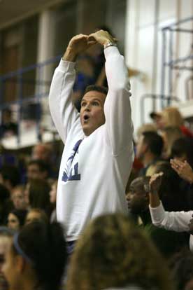 Bryant head football coach Paul Calley joins in the student section's cheers during the game involving his daughter and her Bryant Lady Hornets teammates. (Photo by Rick Nation)
