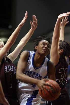 Bryant's Alana Morris fights through the double-team defense of Benton's Joanna Curtis and Rose McGuire (30). (Photo by Rick Nation)