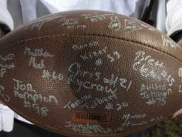 The members of the Bryant Hornets football team signed a football and presented it to Caleb Taylor before the Little Rock Central game.