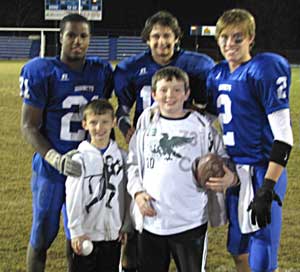 Front from left, Chandler and Caleb Taylor with, back from left, Bryant Hornets seniors Chris Rycraw, Jimi Easterling and Brandon Parish. 