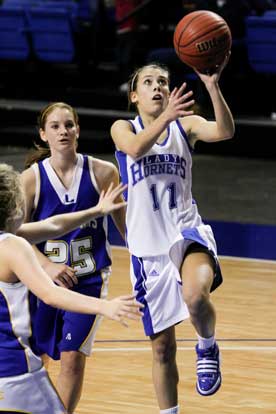 Haley Montgomery (11) launches into a layup on her way to a game-high 17 points in Tuesday's win. (Photo by Gareth Patterson)