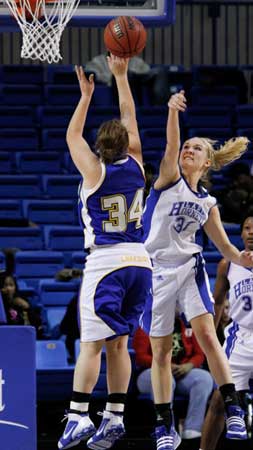 Abbi Stearns blocks a shot by Lakeside's Macy Wiley. (Photo by Gareth Patterson)