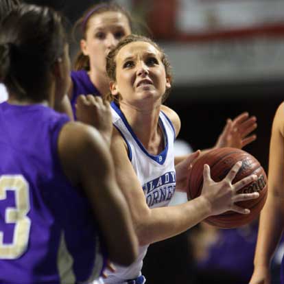 Bryant's Kenzee Calley fights through the CAC defense on a drive to the basket. (Photo by Rick Nation)