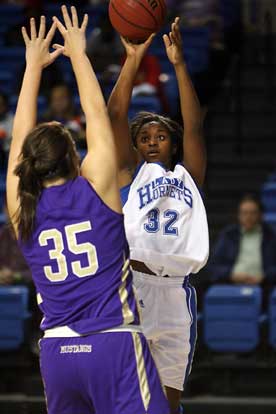 Shanika Johnson, who led the Lady Hornets with 17 points on Wednesday, fires a shot over CAC's Kyla Krueger. (Photo by Rick Nation)