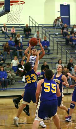 Bryant's McKenzie Adams was surrounded by Sheridan defenders much of the night Thursday but still managed a game-high 12 points. (Photo by Rick Nation)