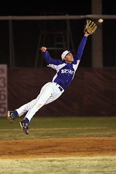 Second baseman Hunter Alford leaps high to try to spear a liner to right.