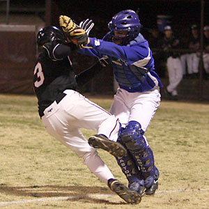 Bryant catcher Brady Butler tags out Searcy's Preston Tarkington after he had been picked off third.