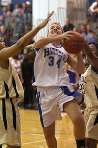 Anna Simpson drives past Little Rock Central's Adre Ann Walker, left, and Shawnsee Arnold.