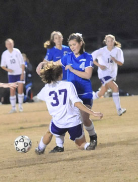 Allison Woodward battles for possession with a Mount St. Mary's player.