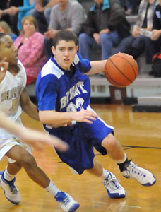 Cody McPherson drives around Sheridan's Jaylynn Elliott during Monday's Central Arkansas Junior High Conference tournament game.