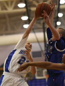 Tyler Nelson, left, blocks a shot by Conway's Shawn Gates.