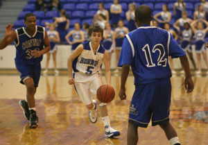 Bryant's Logan Trudell weaves through the Conway Blue defense of Everett Reed (33) and Kevin Guiden (12).