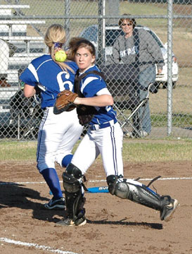 Catcher Sarah Hart makes a play on a bunt during Monday's game at Russellville.