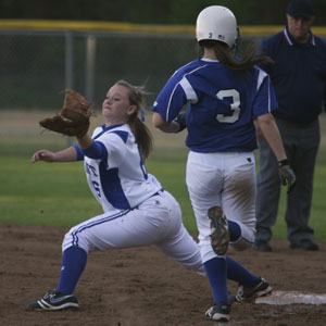 Bryant's Peyton Jenkins stretches for a wide throw to first to retire Conway's Bailey Prout during the sixth inning of Tuesday's game.