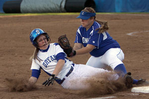 Conway third baseman Mandy Eggert tags out Bryant's Kayla Sory as she slides in after trying to tag and advance from second on a fly to right during the fourth inning of Tuesday's game.