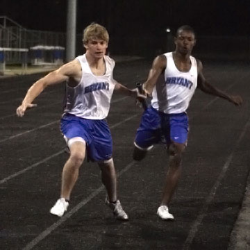 Bryant's Tyler Freshour takes the baton from teammate James Glasper during the 400 meter relay Thursday. (Photo by Rick Nation)