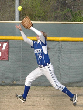 Jenna Bruick hauls in a flyball. (Photo by Mark Hart)