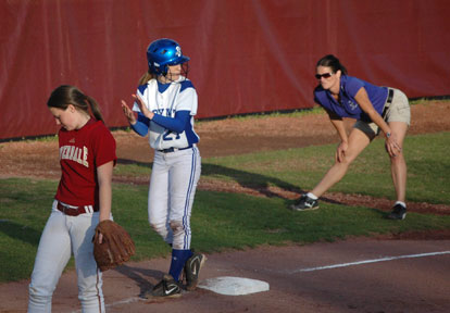 Bryant's Sarah Hart, 27, encourages her teammates as she prepared to lead off third while head coach Lisa Stanfield, right, surveys the situation during a game at the Southern Warriors Invitational Tournament. (Photo by Mark Hart)