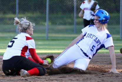Jenna Bruick, right, is tagged out trying to steal second. (Photo by Misty Platt)