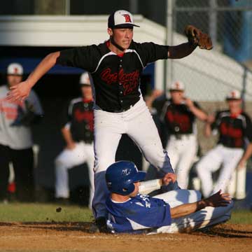 Bryant's Brennan Bullock and Russellville's Heath Moore look to the umpire for a call on a play at the plate. Bullock was tagged out. (Photo by Rick Nation)