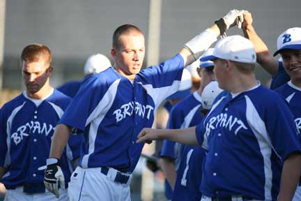 Justin Blankenship is contratulated by his teammates after scoring the game-tying run in the bottom of the sixth Tuesday. (Photo by Rick Nation)