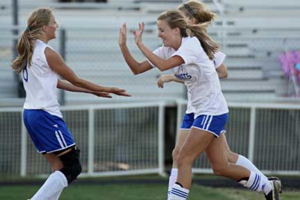 Sarah Manning, left, and Amber Moskow celebrate Moskow's second-half goal against Cabot. (Photo by Misty Platt)