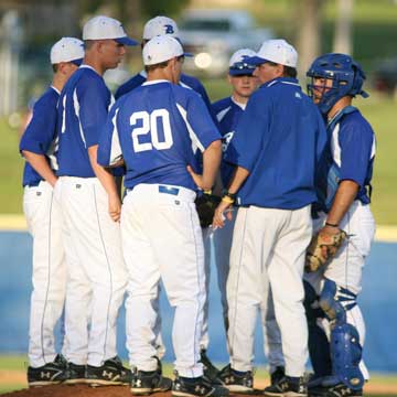 Bryant head coach Kirk Bock meets with his infield during the late stages of Tuesday's game against Russellville. (Photo by Rick Nation)