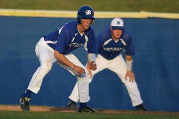 Jonathan Wade leads off first during the bottom of the seventh of Tuesday's game with Russellville. Assistant coach Mark Jelks is in the background. (Photo by Rick Nation)