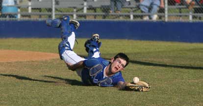 Bryant catcher B.J. Ellis makes a valiant attempt to catch a foul pop. (Photo by Rick Nation)