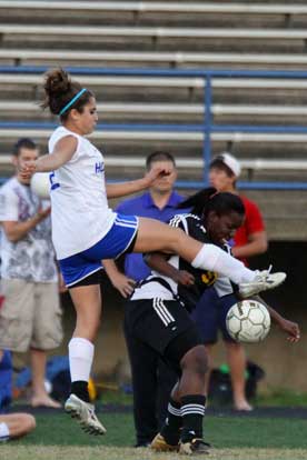 Serenity Gomez, left, leaps to try to get the ball away from a Central player. (Photo by Misty Platt)